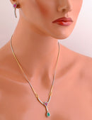 Goldpliated emeral green , ruby red and white diamond set-ou