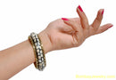 black bangle  white and golden degine