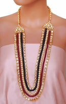 Goldpolish mehroon, green and white kundan set