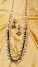 Goldpolish emrald green and white kundan set