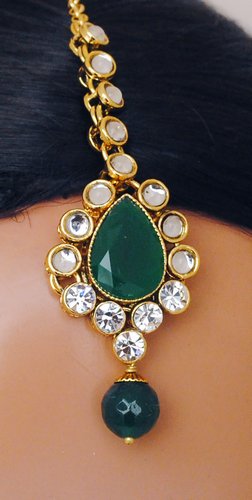 Goldpolish emerald green and white kundan set