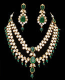 Goldpolish emerald green and white kundan set
