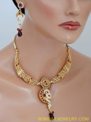 goldplated marron and white polki set with tikka