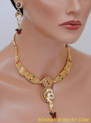 goldplated marron, green and white polki set with tikka