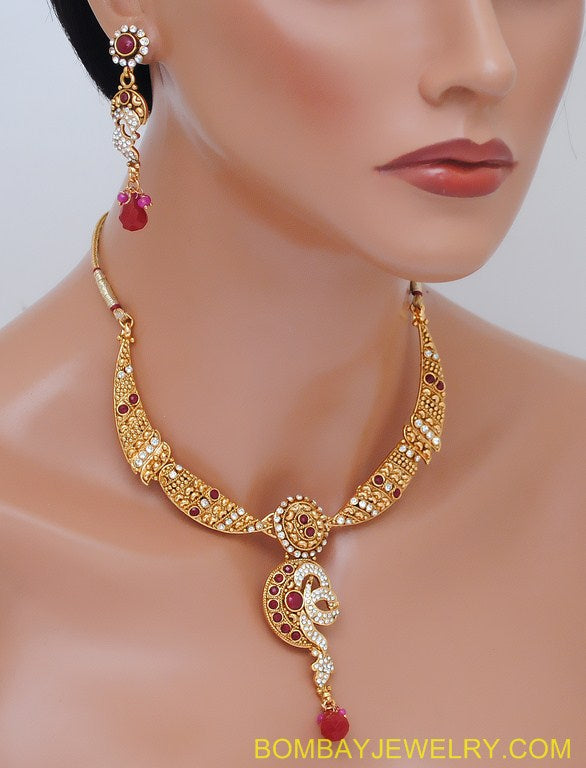 goldplated ruby red and white polki set with tikka